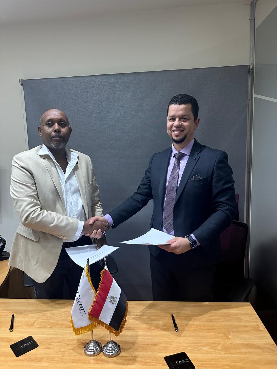 BMD Groupe and Diar Consulting Group representatives shaking hands